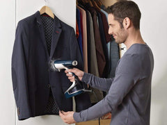 Suit steamer to iron out wrinkles and remove odours from garments