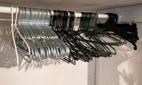 Wire clothes hangers on rack