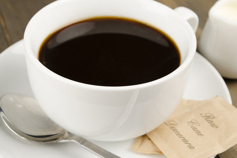 Americano black coffee in a white cup 