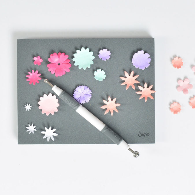Use the Paper Sculpting Tool and Sizzix Craft Adhesive to adhere the flowers together.