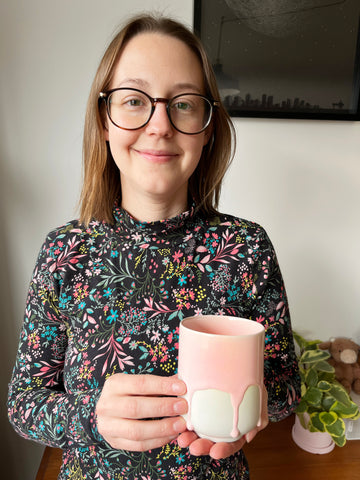 Leah holding a Studio Arhoj mug