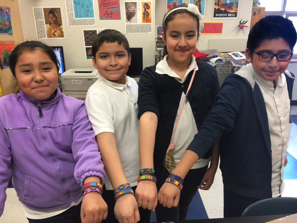 elementary students with friendship bracelets