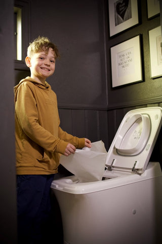 Magnus (10) shows how easy it is to use the Cinderella toilet