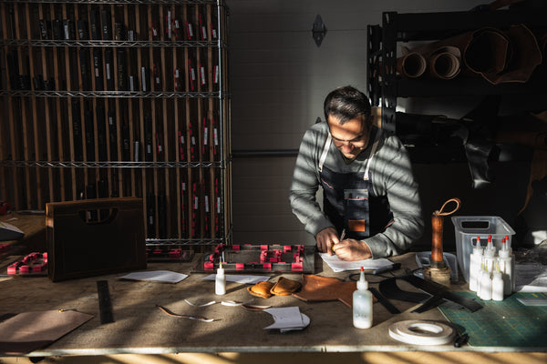 Man labeling tooling in partial sun.