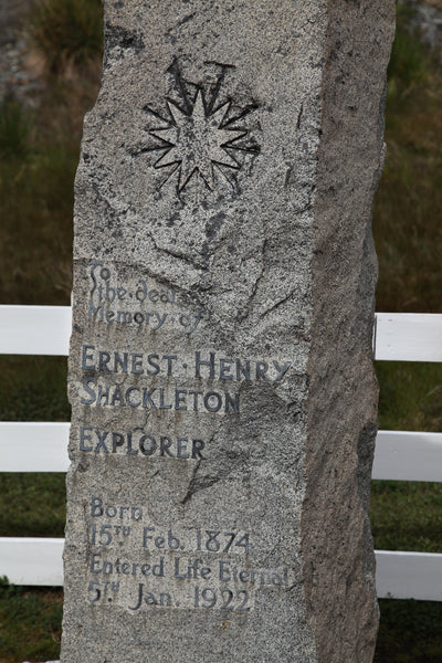 Shackleton's granite gravestone in Grytviken bearing the nine-pointed star.