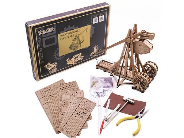 finished counterweight trebuchet model, box, wooden parts boards and tools