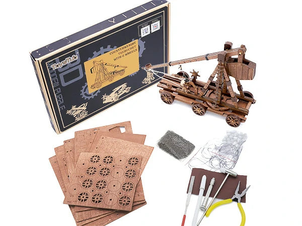 Counterweight Trebuchet With 6 Wheels finished model, wooden parts boards, and tools