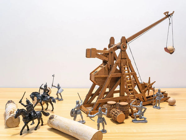 Finished Medieval Trebuchet model with plastic roman soldiers and riders