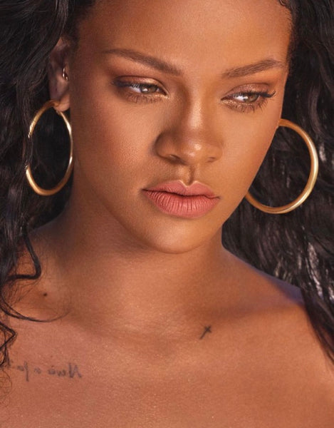 Rihanna with statement gold hoops earrings