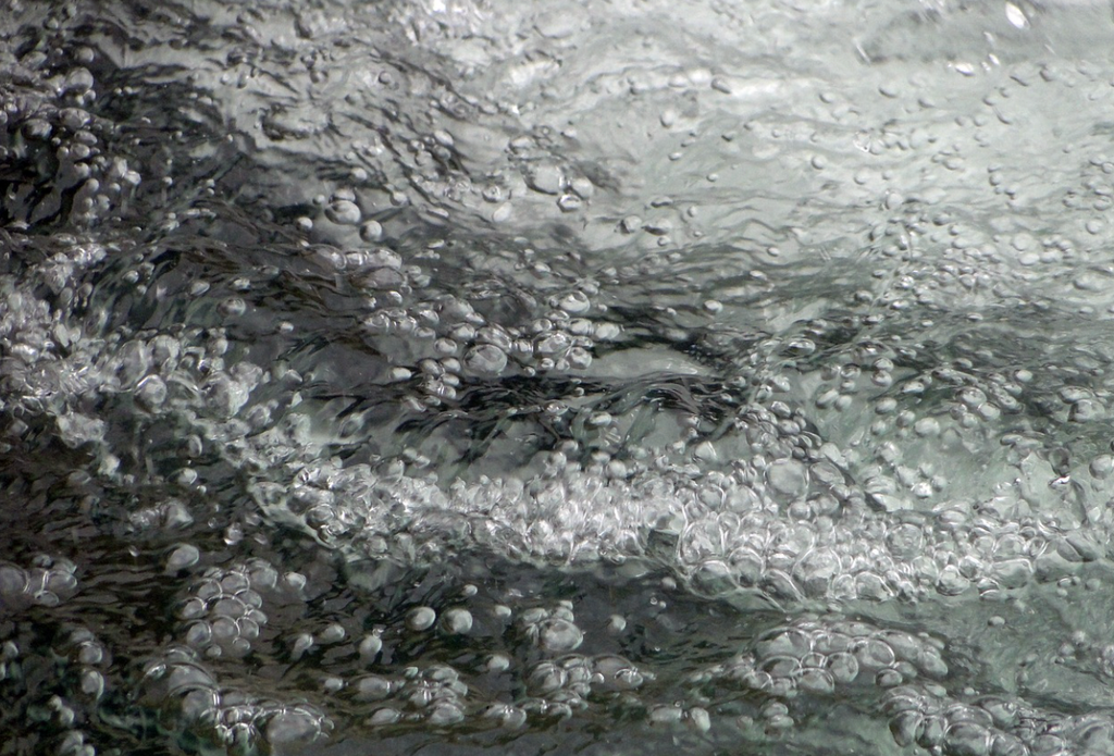 Sea Shore With Bubbles and Rocks