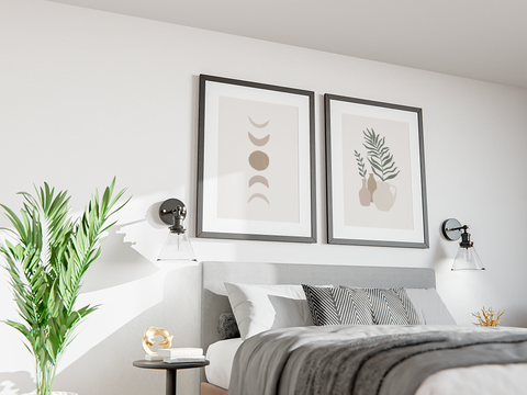 Stylish bedroom featuring printable wall art with abstract moon phases and a botanical vase design, above a bed with chic bedding and decorative wall lamps