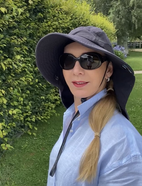 Stephanie Evans wearing a Sun Cube hat while gardening