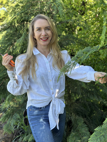 Stephanie Evans wearing a linen shirt in the garden