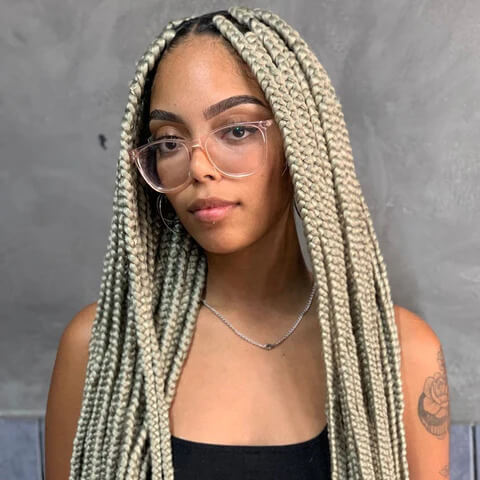 Ash-blonde box braids with dark roots