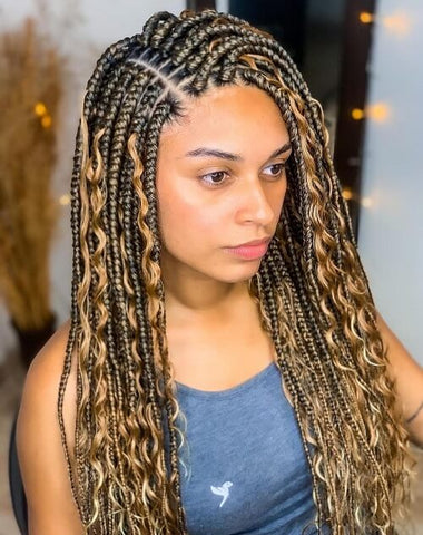 Honey blonde box braids with flowing curly tresses