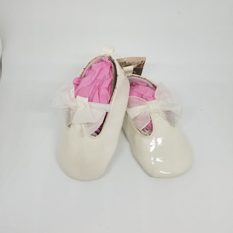 white patent baby shoes