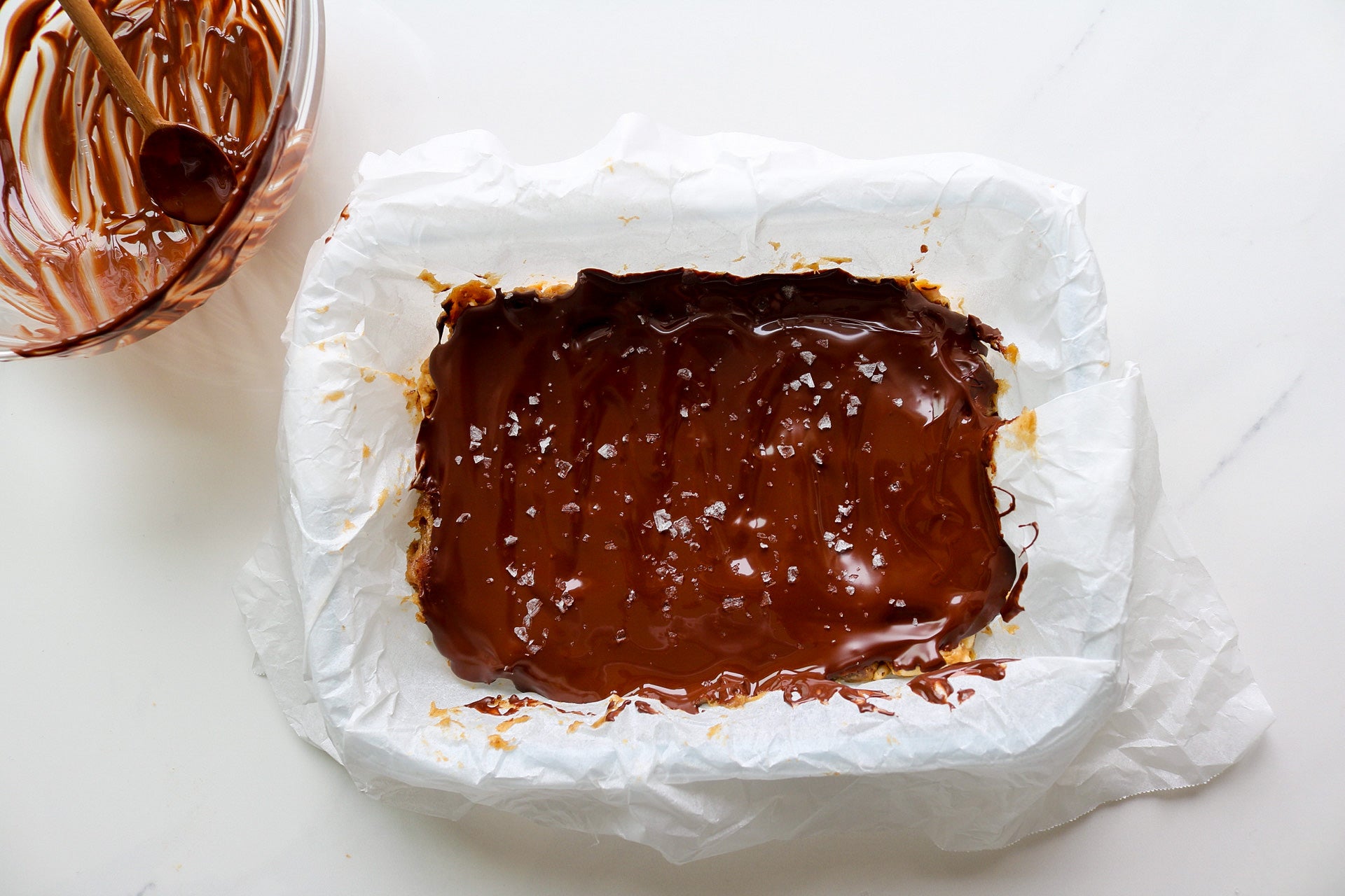 chocolate covered date caramel squares with puffed rice and peanut butter