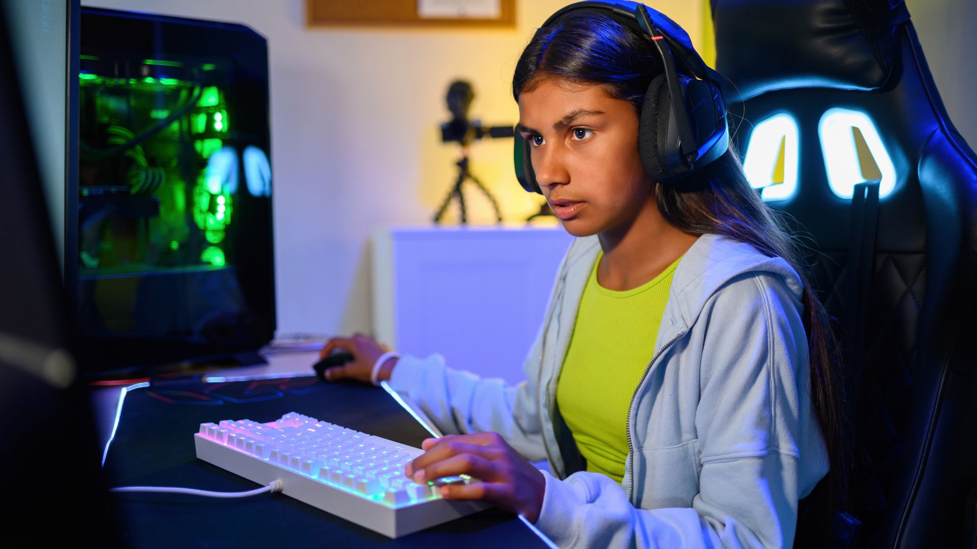 Girl concentrated on her computer playing Roblox