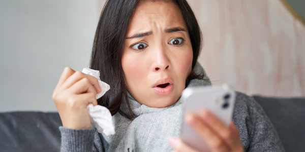 worried-woman-holding-phone