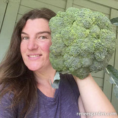Lindsay holding a large head of broccoli