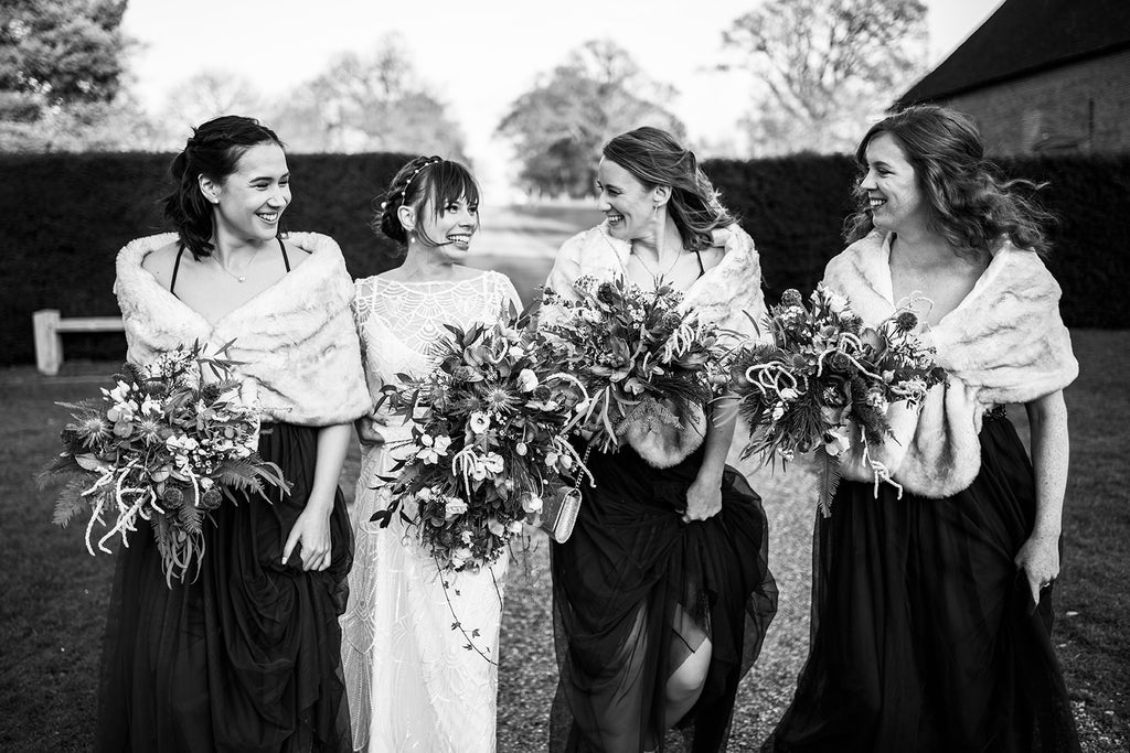 A Winter Wedding with a bride in a pearl headband and her bridesmaids in winter stoles