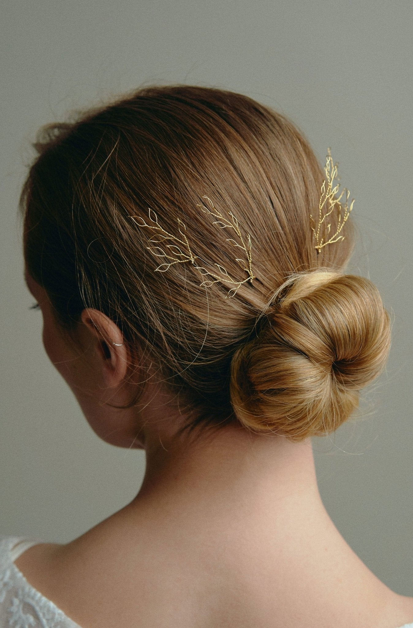 Leafy Wedding Hair Pins - Gold Hairpins worn by model with low bun updo