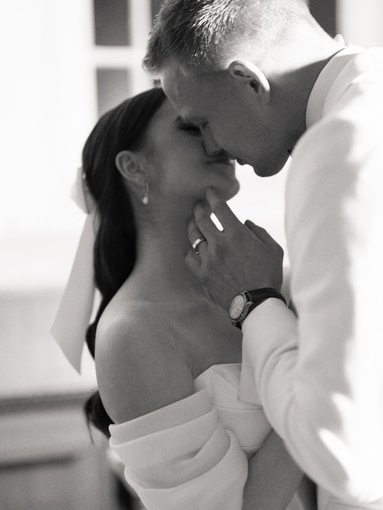 A white satin hair bow for a modern romantic bride and groom