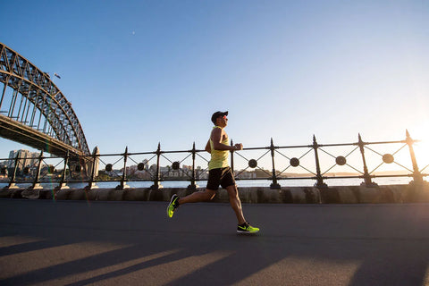 man-running-along-riverfront