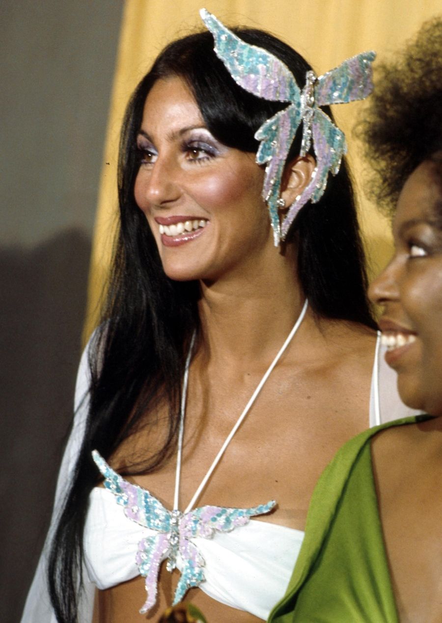 Cher At The Grammys LOS ANGELES - MARCH 2: Entertainer Cher attends the Grammy awards wearing a large butterfly pin in her hair on March 2, 1974 in Los Angeles, California. (Photo by Michael Ochs Archives/Getty Images)