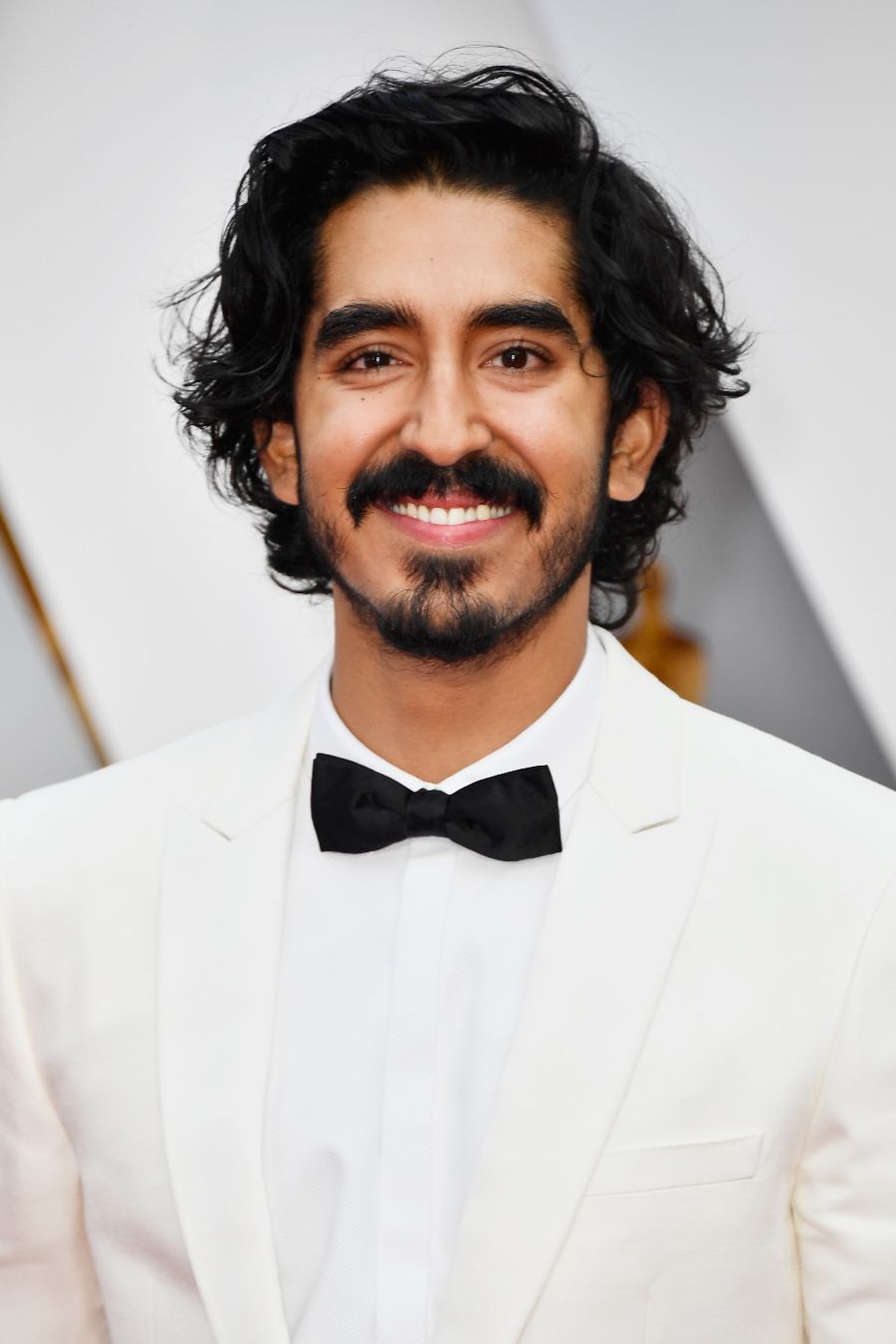 89th Annual Academy Awards - Arrivals HOLLYWOOD, CA - FEBRUARY 26: Actor Dev Patel attends the 89th Annual Academy Awards at Hollywood & Highland Center on February 26, 2017 in Hollywood, California. (Photo by Frazer Harrison/Getty Images) long hairstyles for men