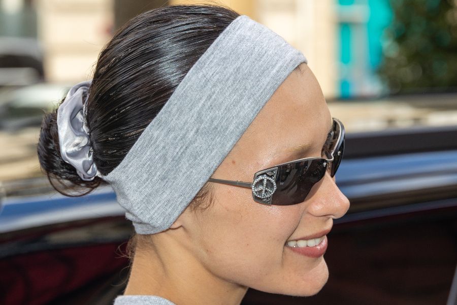 Bella Hadid wearing a cute stretchy headband in gray | Mane Addicts