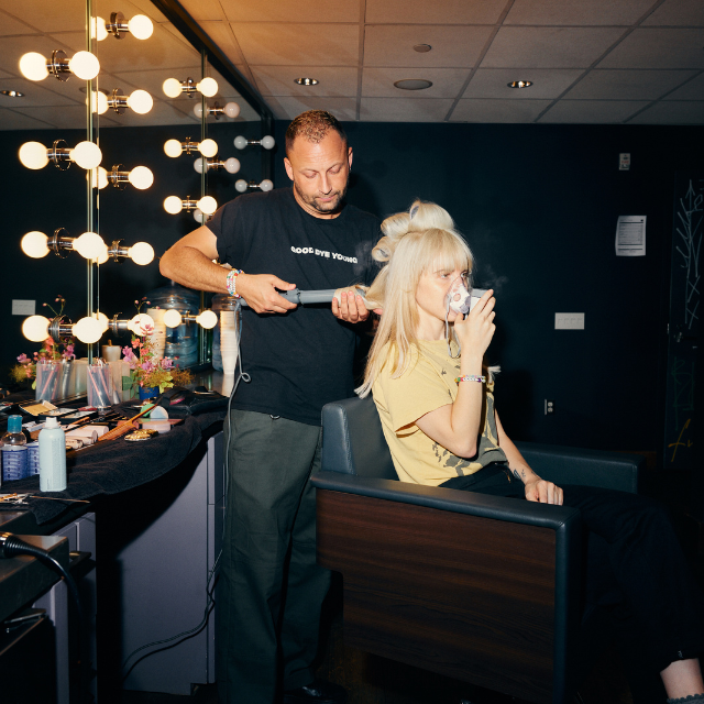 Brian O'Connor curling Hayley Williams' Hair Backstage Before The Paramore Show