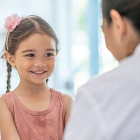 a photo of a young girl seeing a doctor