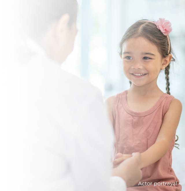 a photo of a young girl seeing a doctor