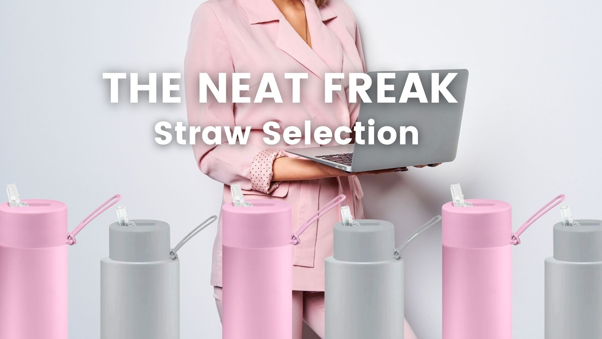 Frank Green pink and grey straw drink bottles in front of a woman in a pink suit with a grey laptop