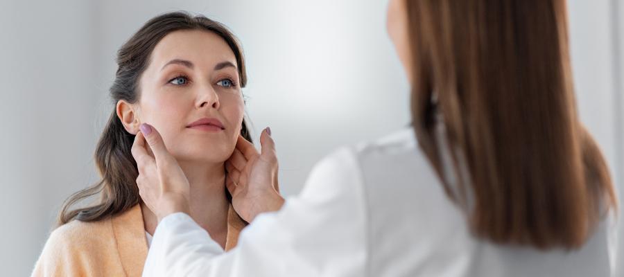 Doctor checking lymph nodes in female patients, lymphatic system