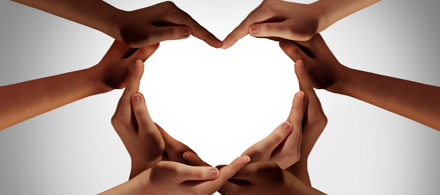 hands coming together on a white background to form a love heart