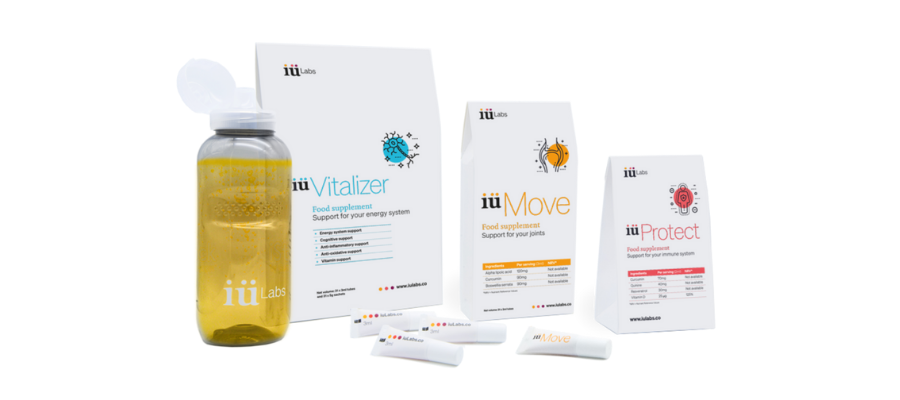 iulabs supplements with orange supplement drink in an iulabs bottle, showing iuvitalizer, iumove, and iuprotect