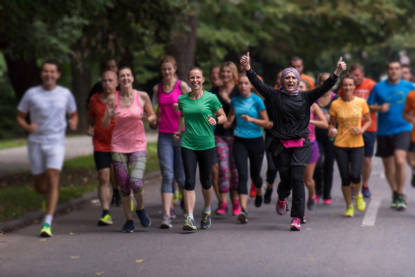 a group of people running on a marathon