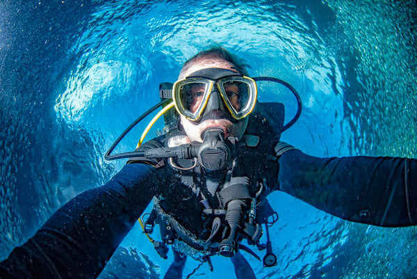 woman taking selfie scuba diving