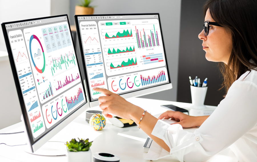 Woman Working On Two 4K Displays