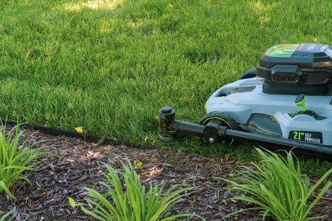 A blue color lawn mower with the Trimyxs attachment