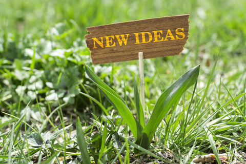 A wood made plate with the note, "new ideas"