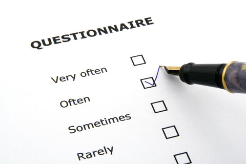 A pen ticks the "often" box on a list of questionnaires categorized as very often, often, sometimes, and rarely