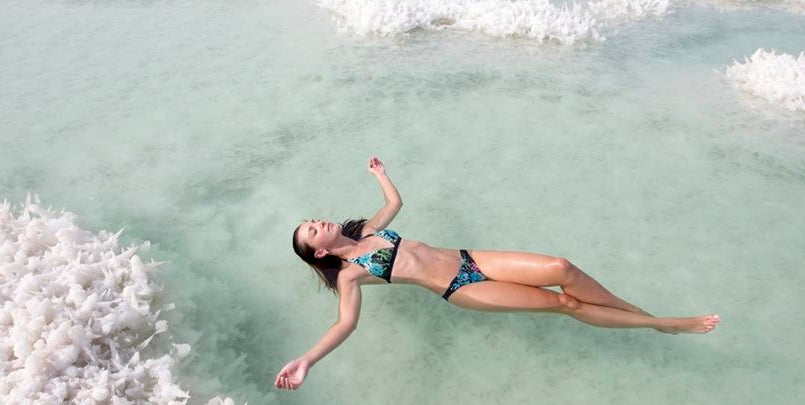 Lady swimming in the dead sea