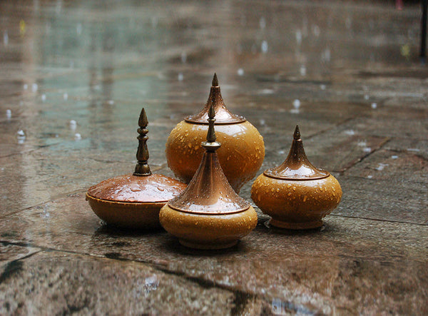 Marble Spire Jars by AnanTaya Decor, on stone floor in the rain