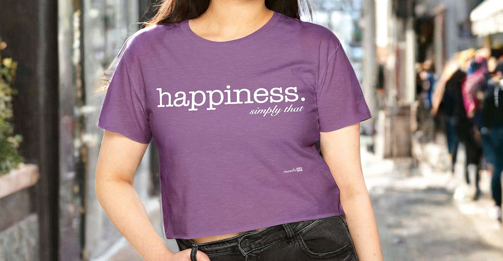 girl wearing a muquifu ladies-t festival crop top with the lettering happiness simply that