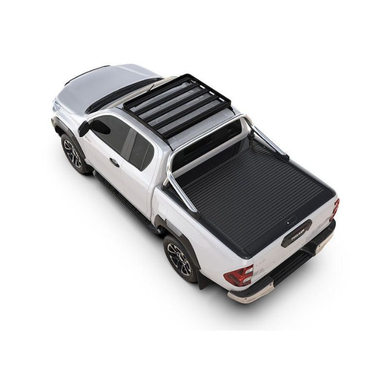 Stylish white pickup truck with a black truck bed cover and roof rack