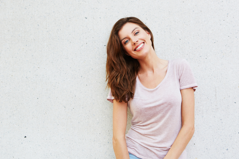 Adult woman in pink shirt smiling