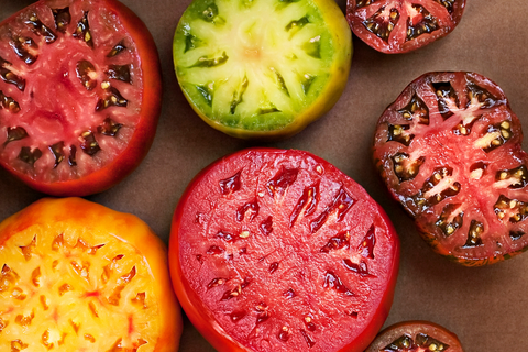 Heirloom tomatoes cut in half with seeds exposed